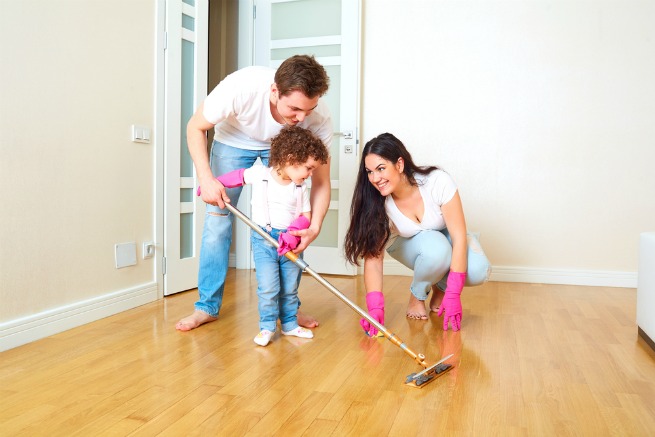 Image of family using mop as best cleaner for laminate floor