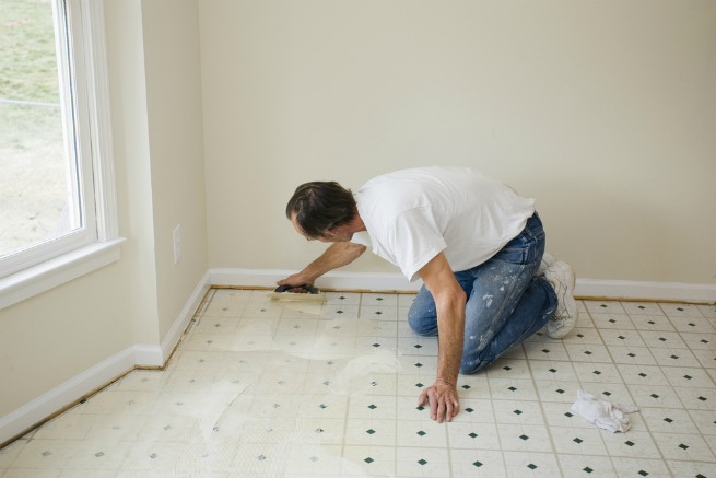 Image showing a man laying a subfloor